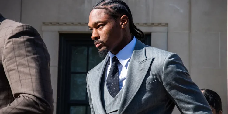 Stefon Diggs not guilty verdict as he leaves Massachusetts courthouse in gray suit